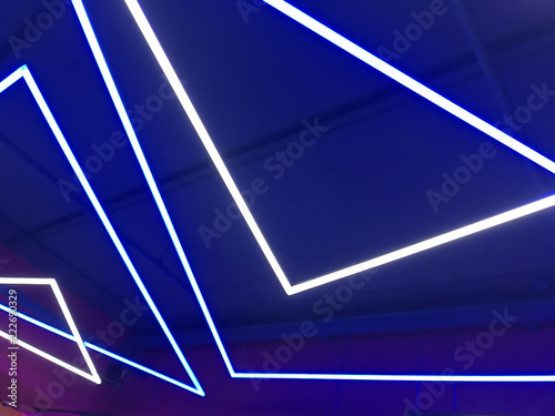 Blue white purple neon lights on ceiling and wall