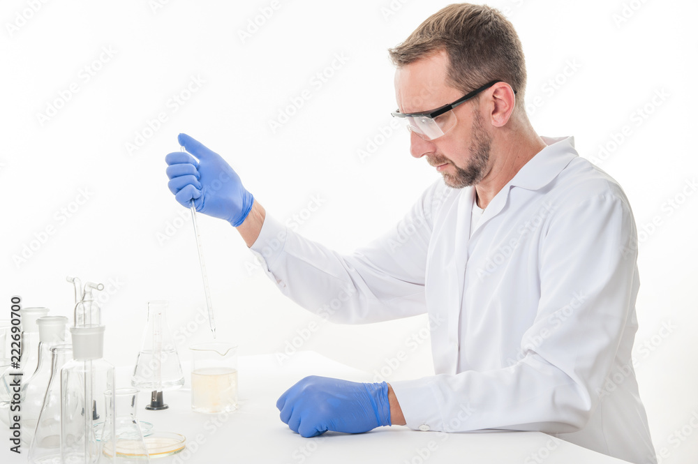 man in the laboratory / view of a man in the laboratory while performing experiments
man in the laboratory / view of a man in the laboratory while performing experiments