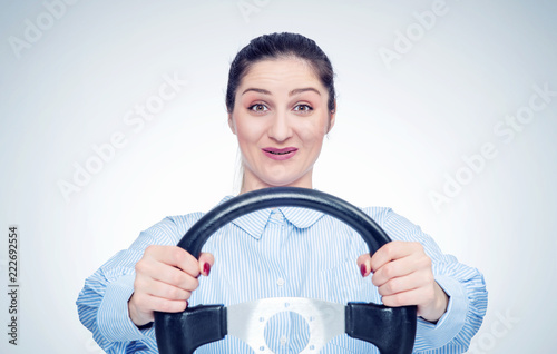 Happy young woman driver car with steering wheel, auto concept 