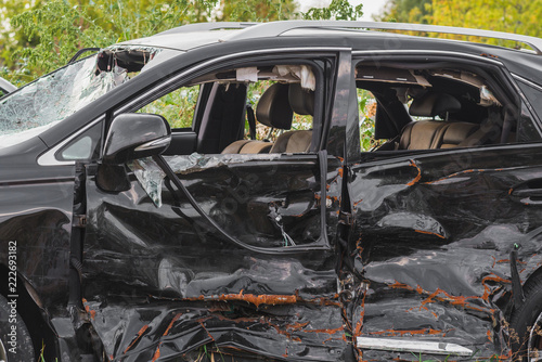 Schilderij op canvas crashed doors of off-road car after the accident are on the sidelines