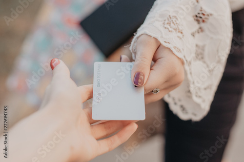Hands holding debit card. Paying by credit card