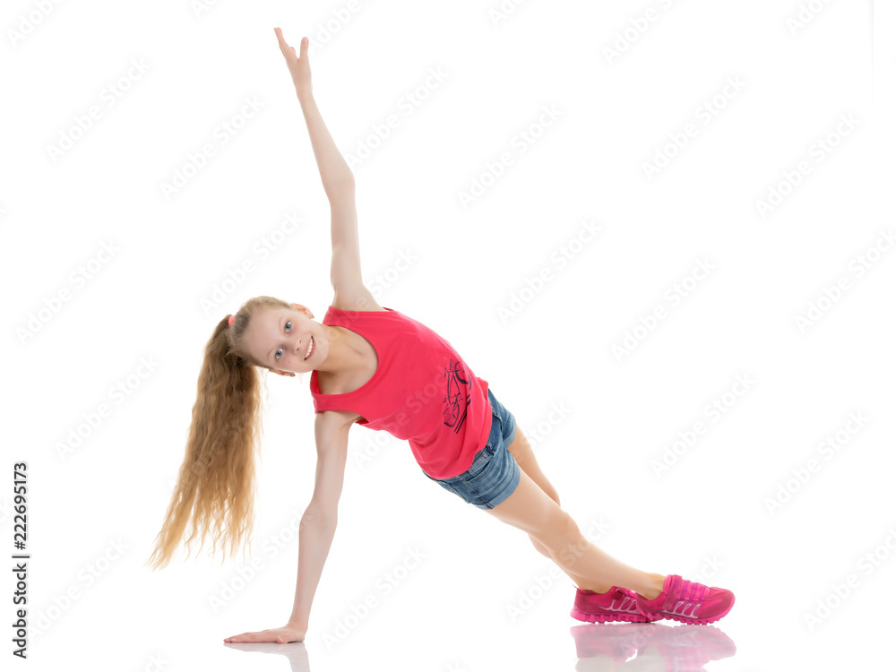 The gymnast perform an acrobatic element on the floor. The gymnast perform an acrobatic element on the floor.