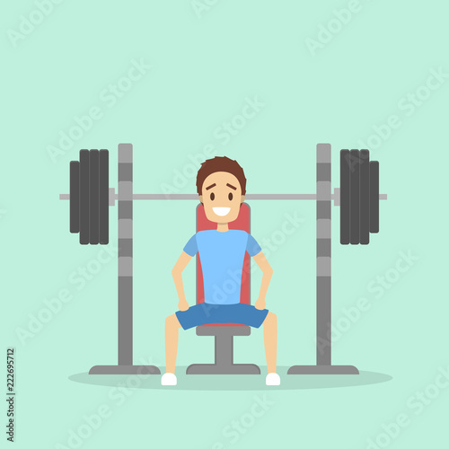 Handsome man lifting heavy barbell in the gym