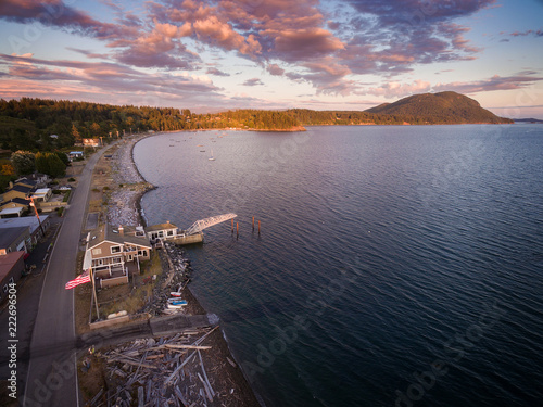 Aerial View of Legoe Bay on Lummi Island, Washington. Coastal sunset view of the west side of Lummi Island located in the Salish Sea area of the Pacific Northwest and Washington state. photo