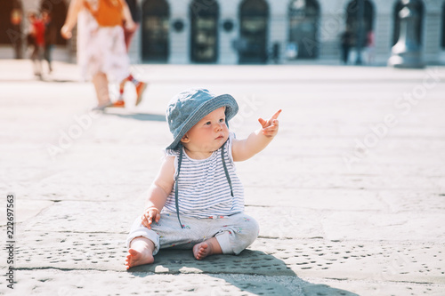 Little child outdoors in a italian european town. photo