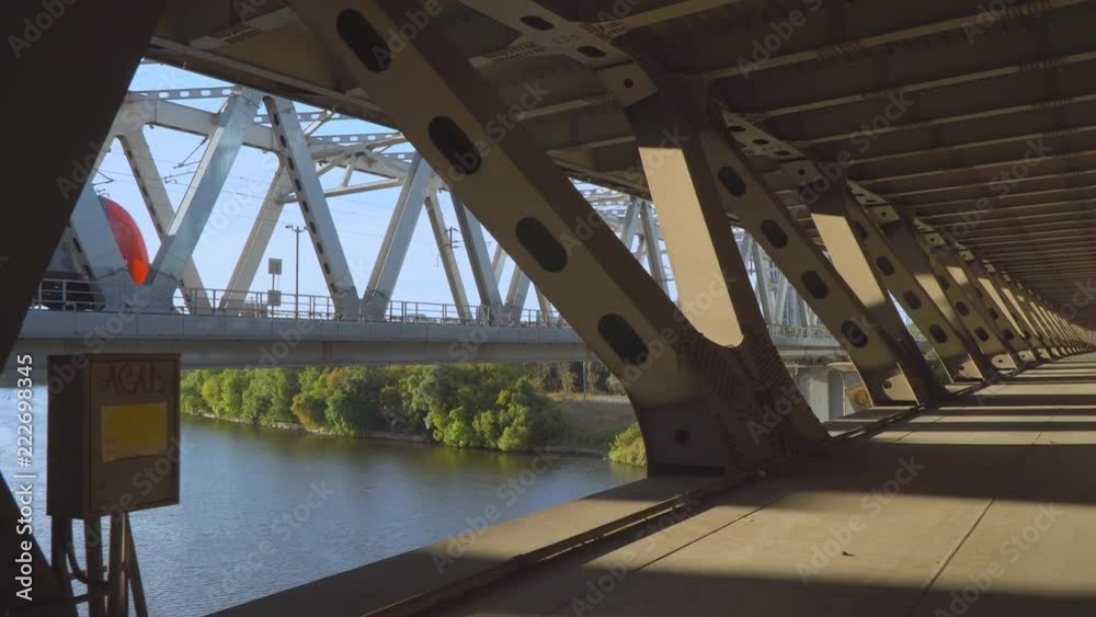 view of the city from inside the spatial structure of the steel bridge