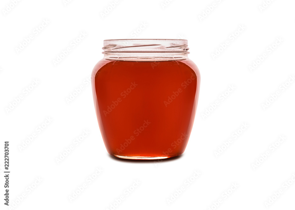 Honey in jar isolated on a white background Honey in jar isolated on a white background