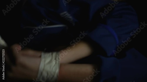 Criminal kidnapping young woman and putting her down in car trunk, crime