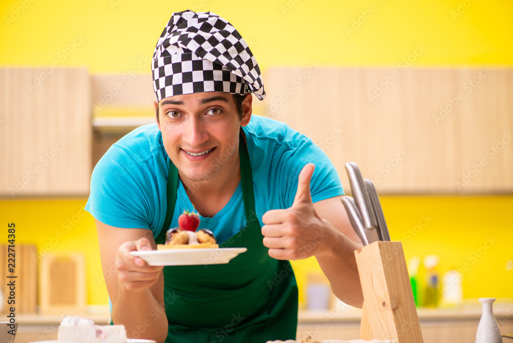 Man cook preparing cake in kitchen at home Man cook preparing cake in kitchen at home