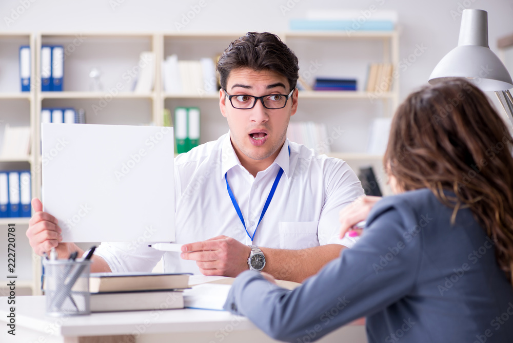 Sales assistant discussing transaction with customer Sales assistant discussing transaction with customer