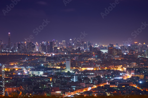 night cityscape with light tail speed line in metropolis