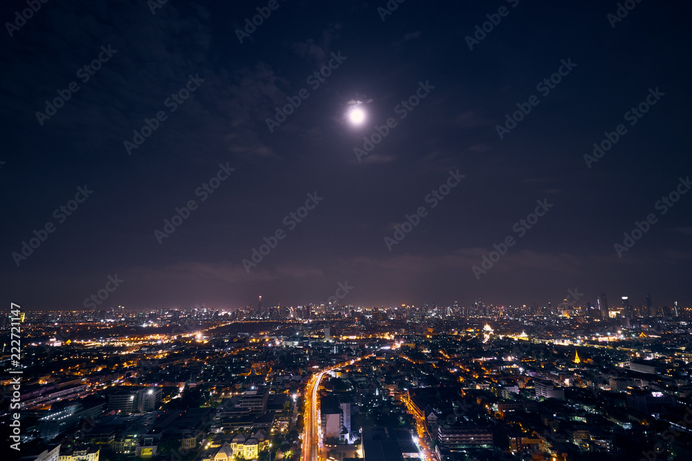 night cityscape with light tail of speed line bridge