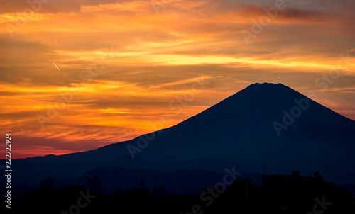 Golden sunset behind the silhouette of mount Fuji