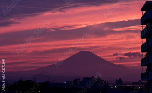 Red sunset behind the silhouette of mount Fuji