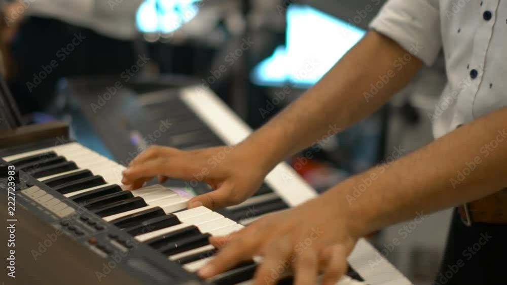 close-up musician lead electric keyboard in live concert musical band close-up musician lead electric keyboard in live concert musical band