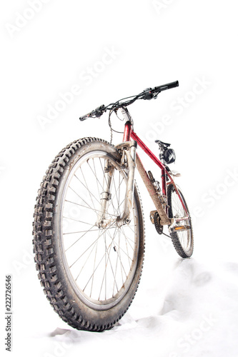 very dirty mountain bike, downhill position