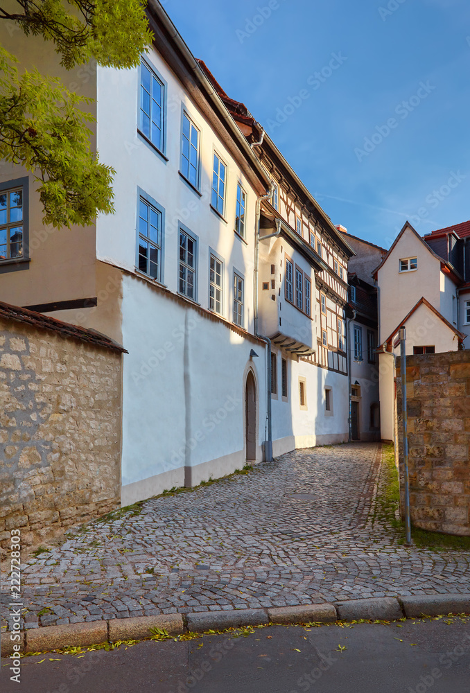 Large three-story white-washed historical timber house in Erfurt, Germany