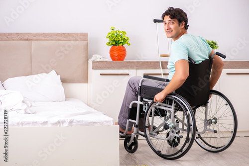 Bild auf Leinwand Young handsome disabled man recovering at home