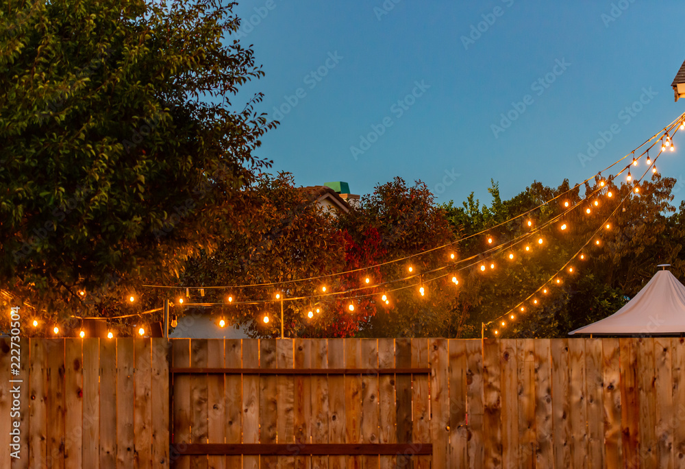 Party lights hanging down from a house Stock Photo Adobe Stock