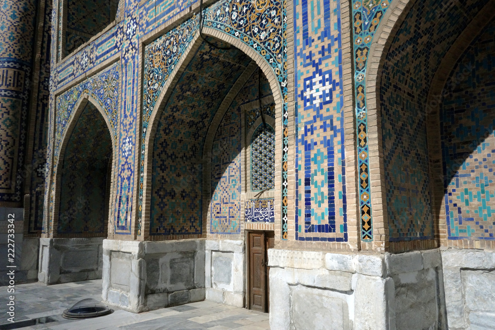 Small door and the mosque in Samarkand, Uzbekistan