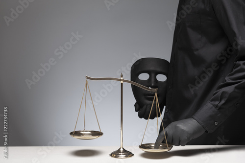 Man holding evil mask