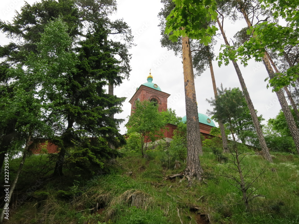 Church on the background of mountainous terrain and pine trees on the island of Valaam. Church on the background of mountainous terrain and pine trees on the island of Valaam.