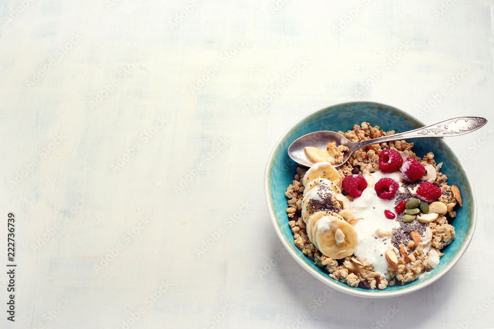 Bowl of granola with yogurt and fresh berries Bowl of granola with yogurt and fresh berries