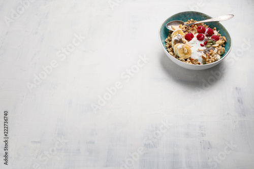 Bowl of granola with yogurt and fresh berries
