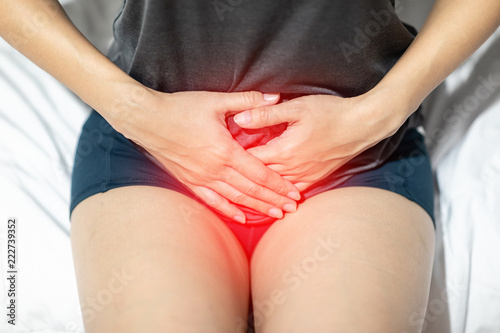 Wallpaper Mural woman have bladder or uti pain sitting on bed in bedroom after wake up feeling so illness,Healthcare concept Torontodigital.ca