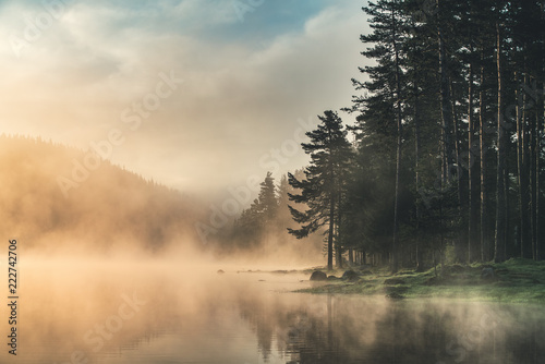 Fototapeta Naklejka Na Ścianę i Meble -  Morning fog on the lake, sunrise shot