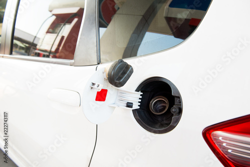petrol cap cover open ready to fill up the fuel at gas station
