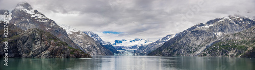 Johns Hopkins Glacier and mountains on a cloudy day in Glacier Bay National park Alaska