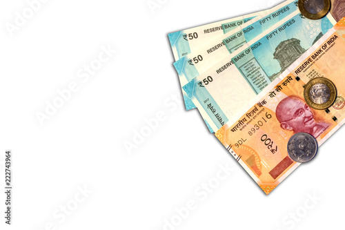 New Indian 50 and 10 rupees with 10 rupees coin on white isolated background. © WESTOCK