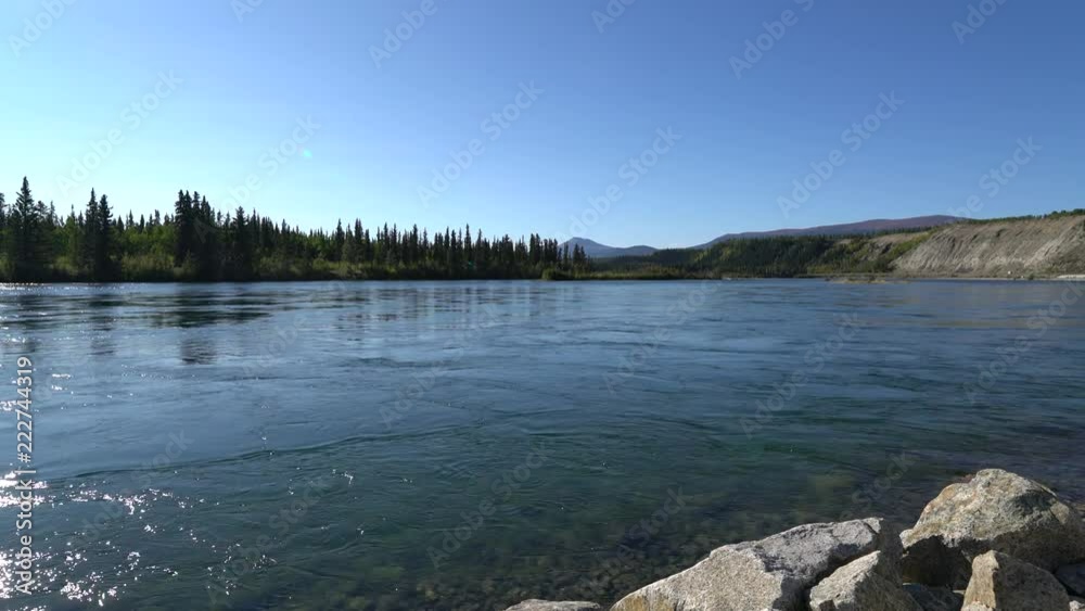 Whitehorse,Canada-September 10, 2018: View of Yukon River flowing near SS Klondike Whitehorse,Canada-September 10, 2018: View of Yukon River flowing near SS Klondike