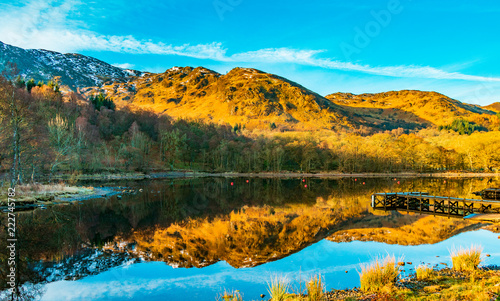 Fototapeta Naklejka Na Ścianę i Meble -  Early morning reflections at Loch Earn, Scotland