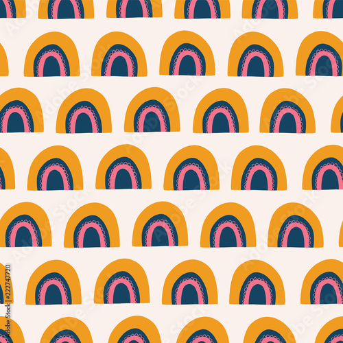 Abstract rainbows seamless vector pattern. Cute hand drawn rainbows orange, pink, and blue on white background. Scandinavian style. Great for kids market - fabric, paper, wallpaper, gift wrap, girl