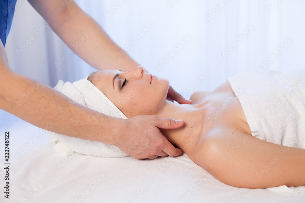 Obraz premium face and neck massage beautiful woman at Spa