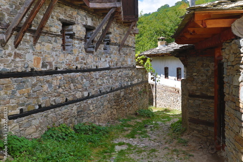 Fototapeta Naklejka Na Ścianę i Meble -  Old houses in the historical cultural reserve village of Dolen, Bulgaria. Dolen is famous with its 350 old houses – an example of 19th century Rhodopean architecture. 