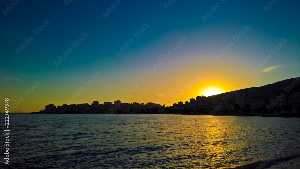 Sunset Panoramic view to Saranda city and bay of Ionian sea, Albania