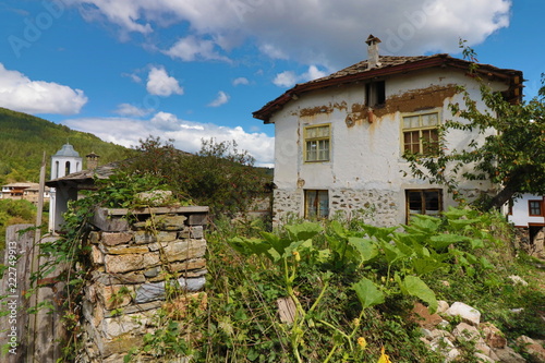 Old houses in the historical cultural reserve village of Dolen, Bulgaria. Dolen is famous with its 350 old houses – an example of 19th century Rhodopean architecture. photo