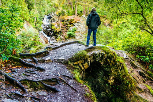 Standing at The Falls of Bruar, near Blair Atholl, Scotland photo