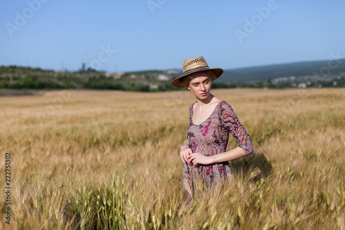 beautiful woman farmer in field of wheat farm