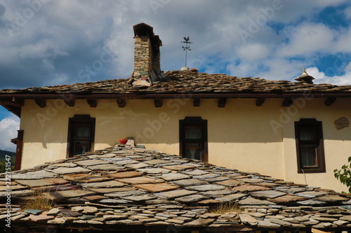 Old houses in the historical cultural reserve village of Dolen, Bulgaria. Dolen is famous with its 350 old houses – an example of 19th century Rhodopean architecture. photo