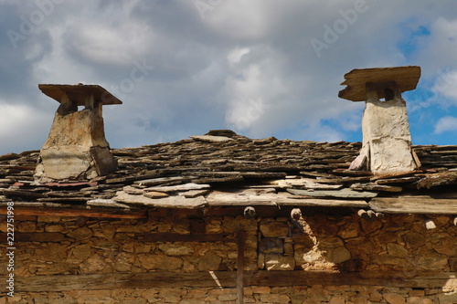 Old houses in the historical cultural reserve village of Dolen, Bulgaria. Dolen is famous with its 350 old houses – an example of 19th century Rhodopean architecture. photo