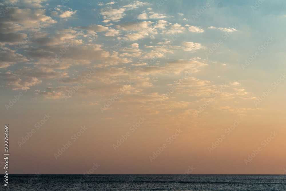 beautiful cloudy sunset on the sea beach
