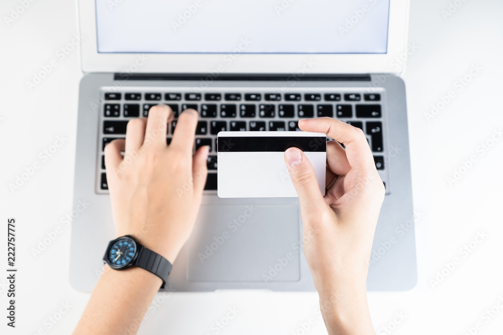 Paying with credit card online. Person filling bank account information while purchasing something in internet Paying with credit card online. Person filling bank account information while purchasing something in internet