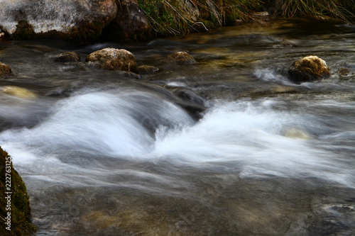 Spring water mountain river and the cute petrous creek on North Caucasus. mountain natural landscape photo