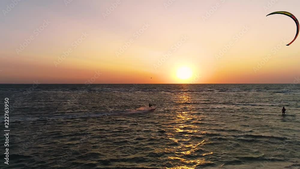 Aerial shooting, kiters ride on the waves and perform tricks