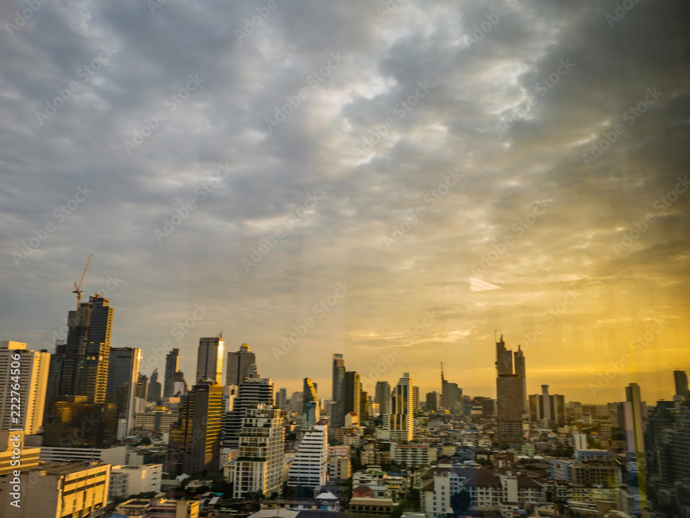 Bangkok city scape with orange sunset sky