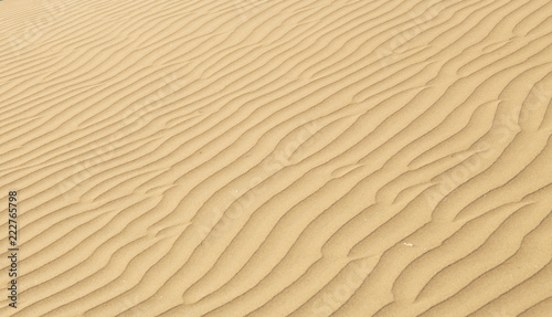 Ripples in the desert sand, hot and dry